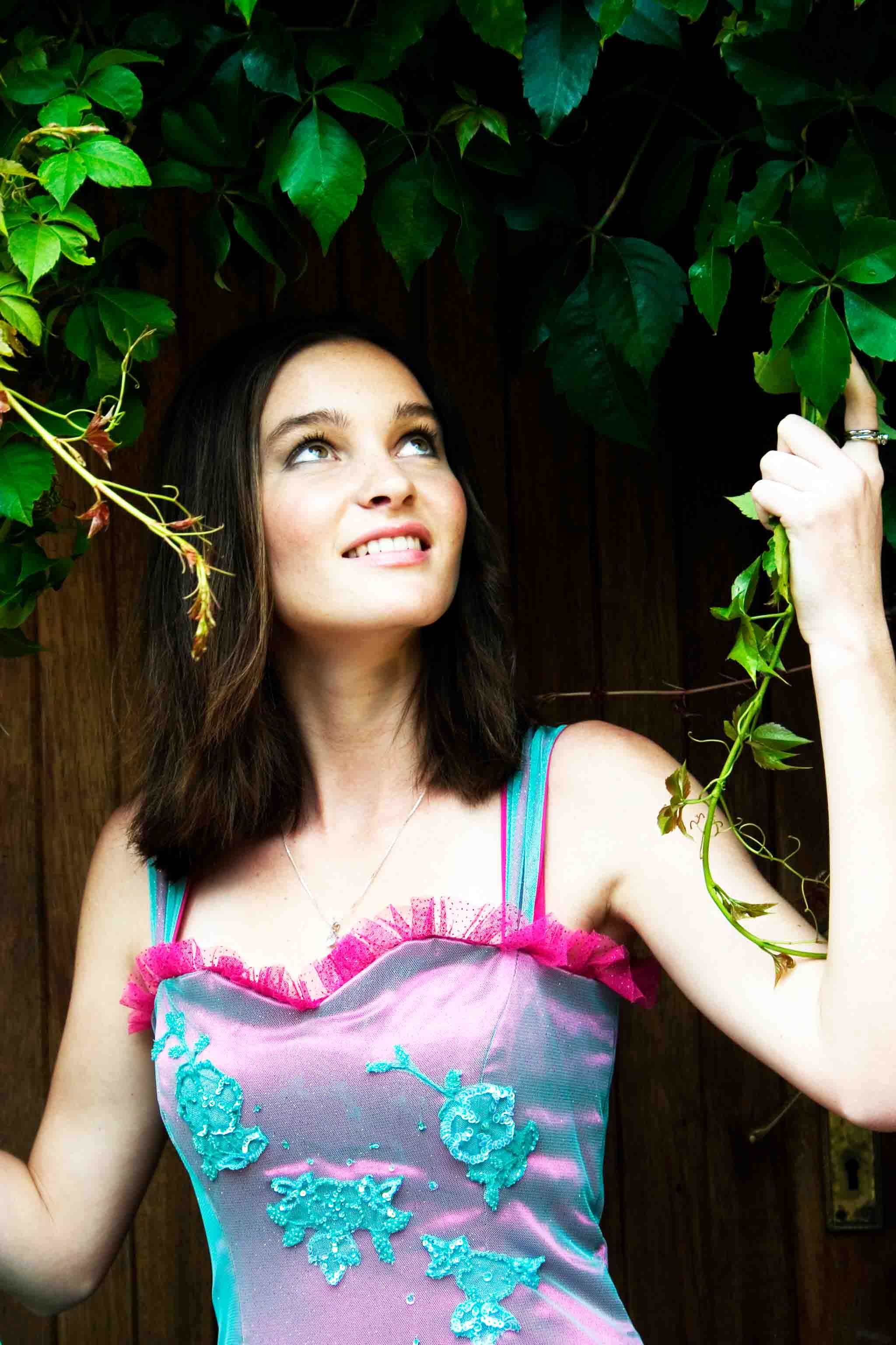 Jaydene posing in an ivy-doorway