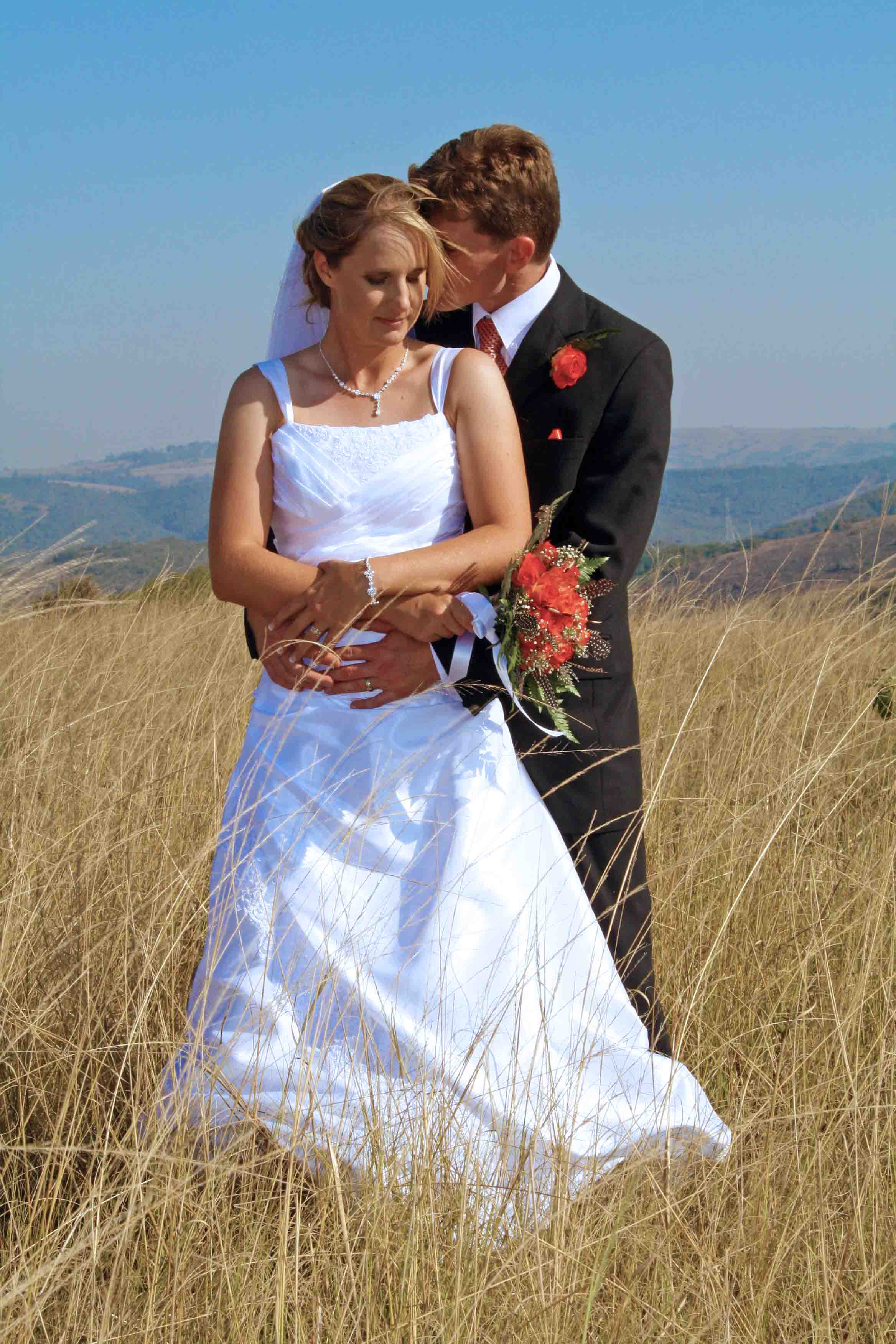 Brad and Emma in long grass