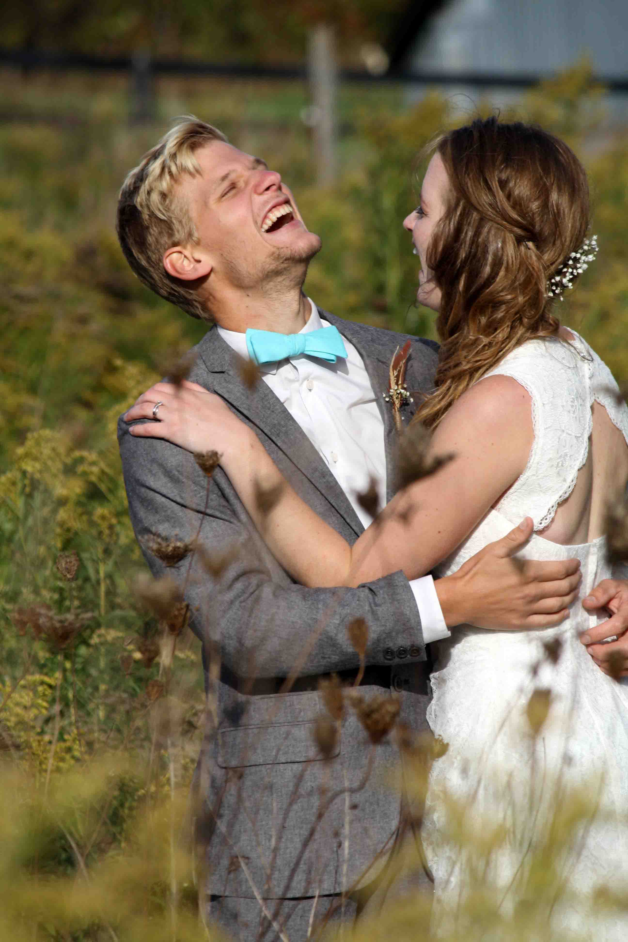 Greg and Karen joking in long grass