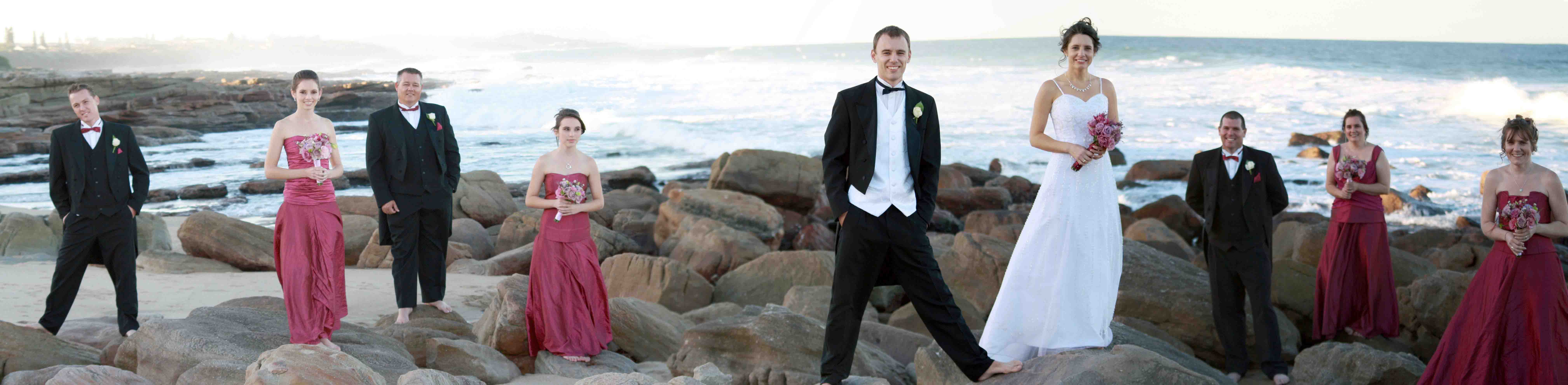 The bridal party on the rocks on St Michaels Beach
