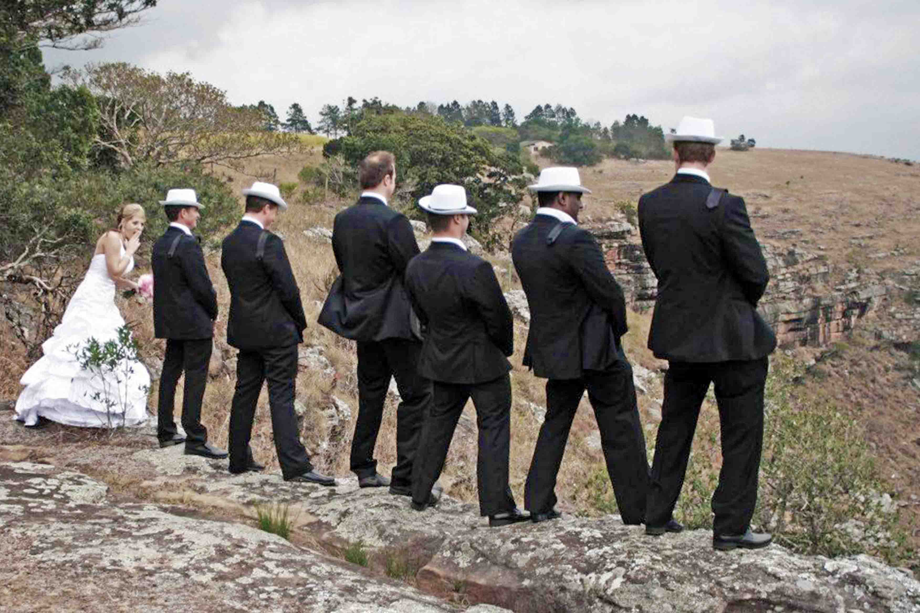 The bridal party on the rocks on St Michaels Beach