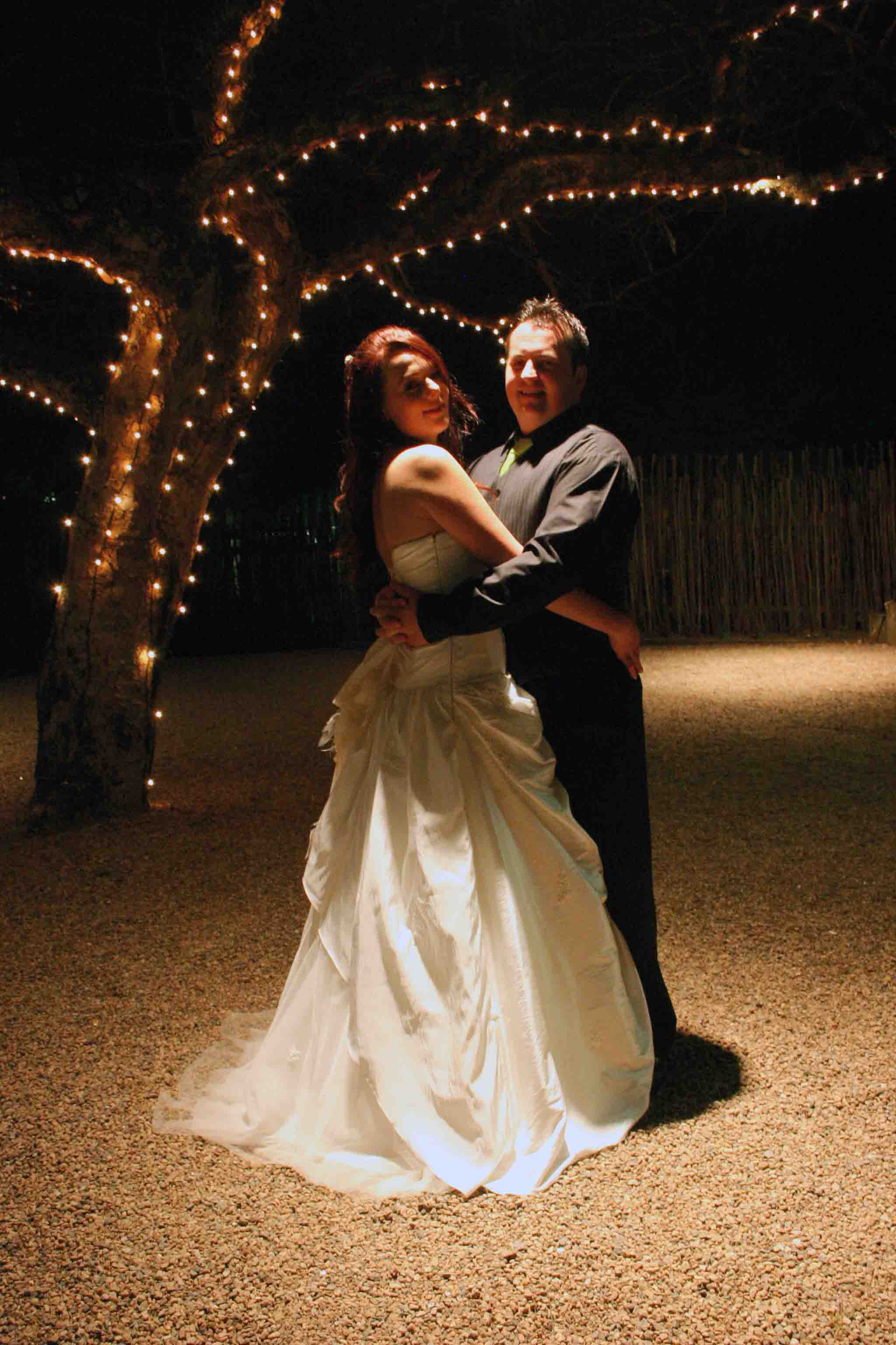 Morne and Jenna at the Reception, under the lit tree