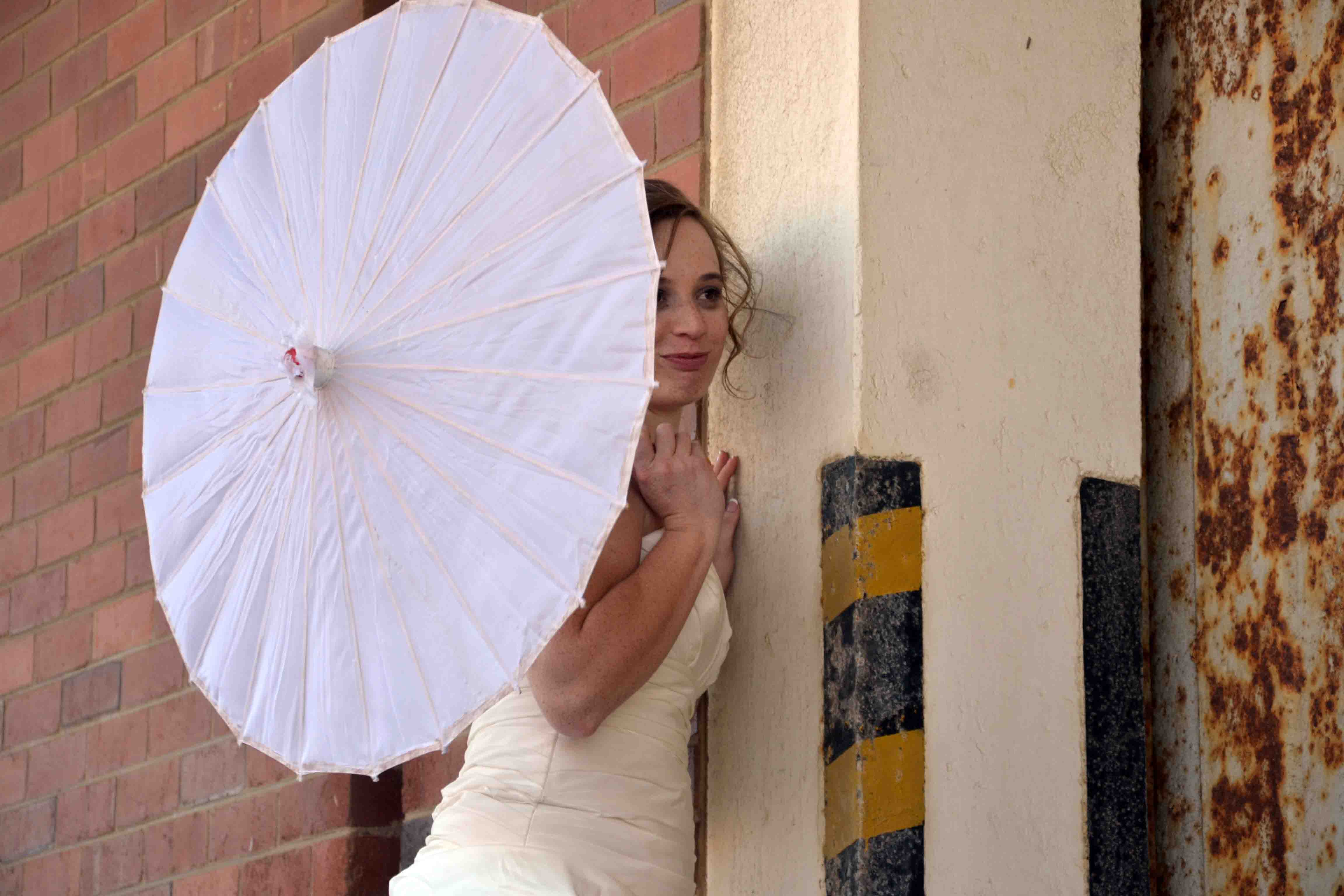 Kir sneaking a peak behind the umbrella